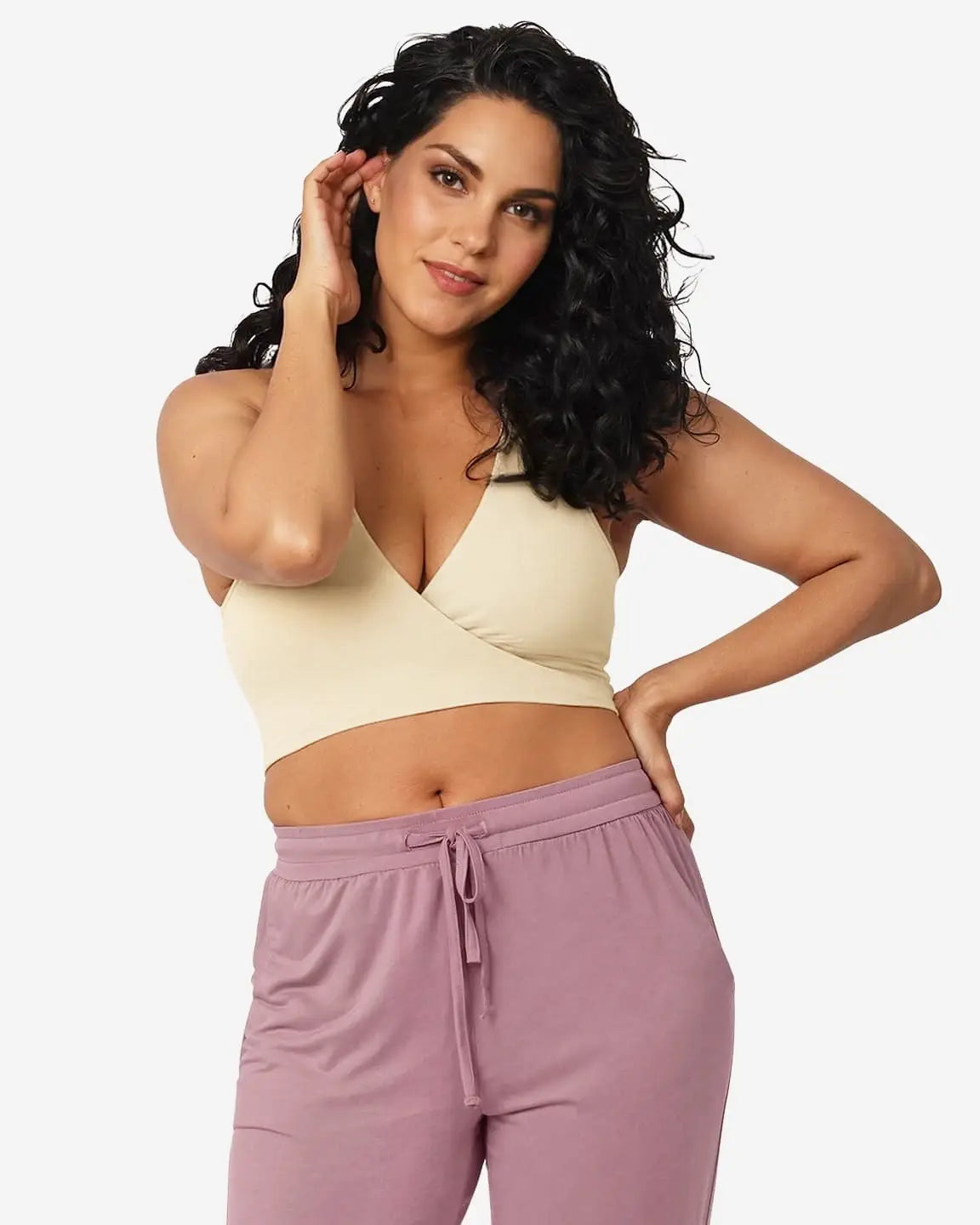 Woman wearing a beige Soft Cotton Wire-Free Nursing Bra with a comfortable crossover design.