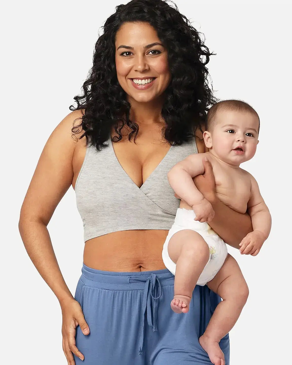 Smiling mother in a gray soft cotton wire-free nursing bra holding her baby.