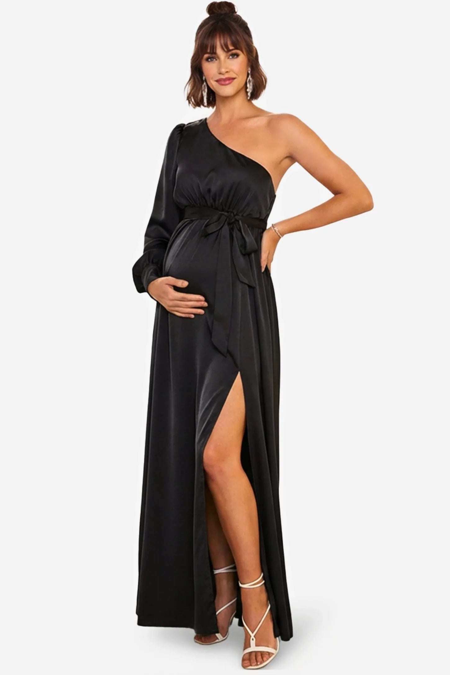 Elegant black satin one-shoulder maternity maxi dress with a high slit, long sleeve, and tie-waist.
