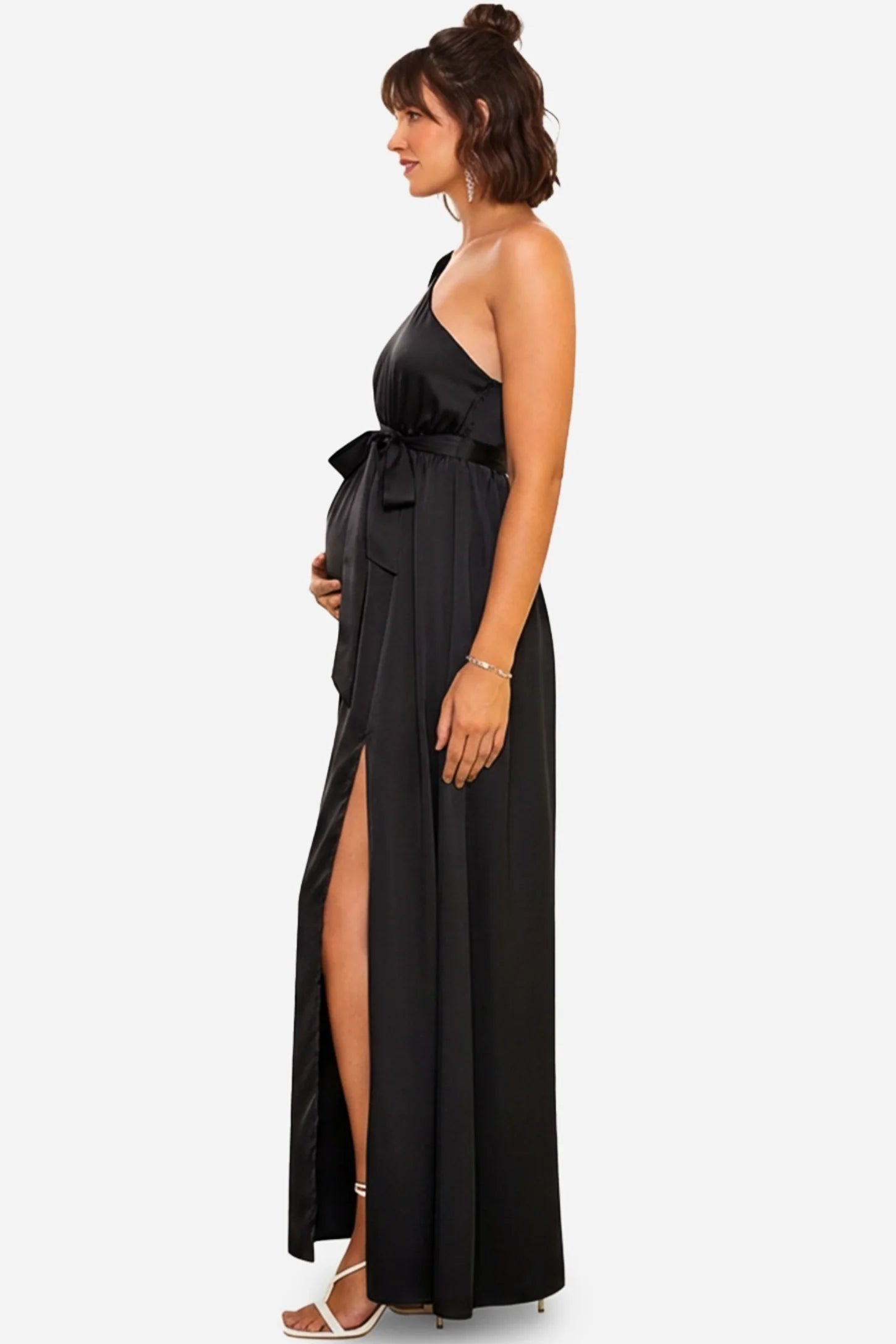 Black satin one-shoulder maternity maxi dress with a high slit and tie-waist detail.