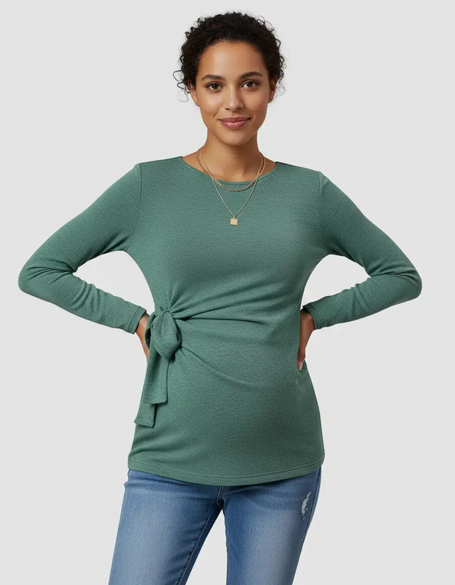 Green long-sleeve maternity top with adjustable side-tie, worn by a smiling woman.