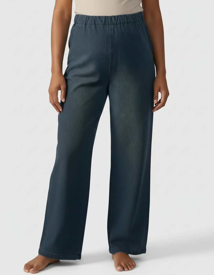 Dark blue wide-leg maternity denim pants with an adjustable elastic waist, worn by a person.