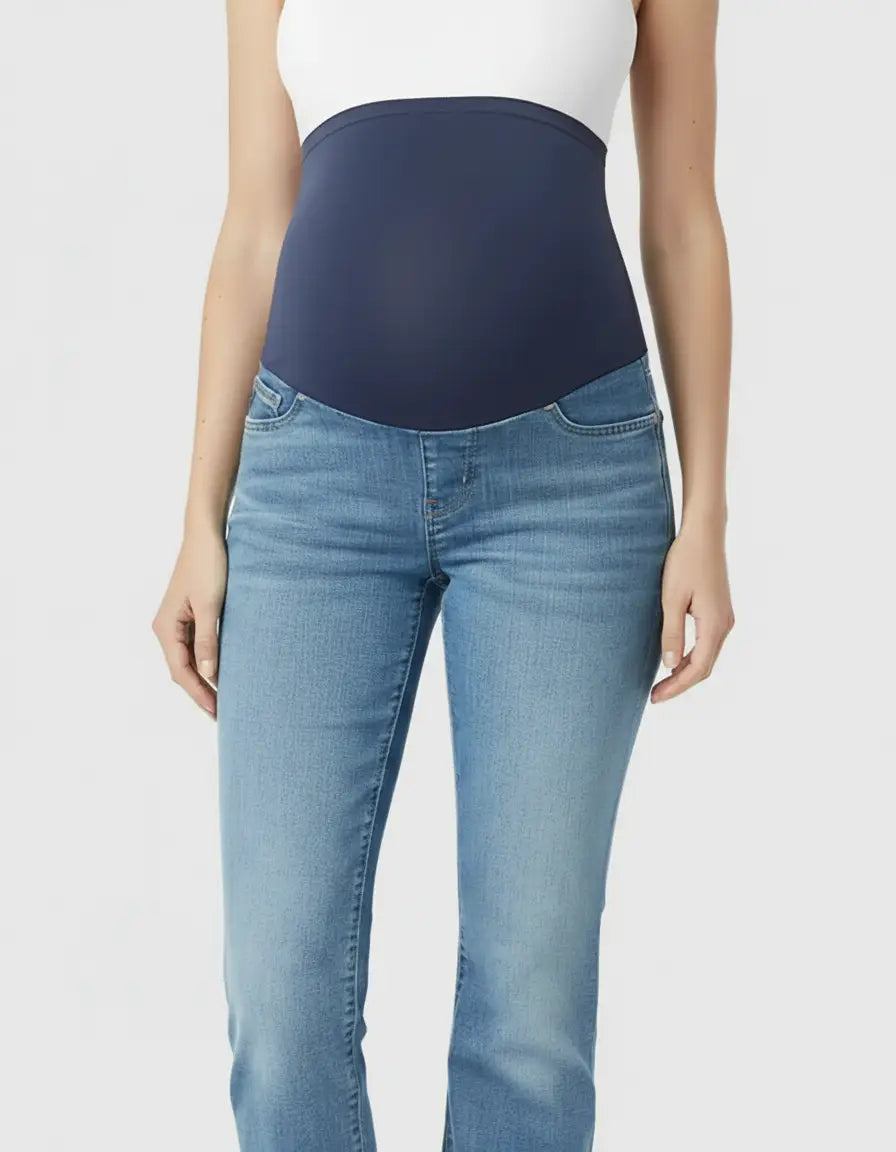 Light wash flared maternity jeans with a navy over-belly panel and white top.