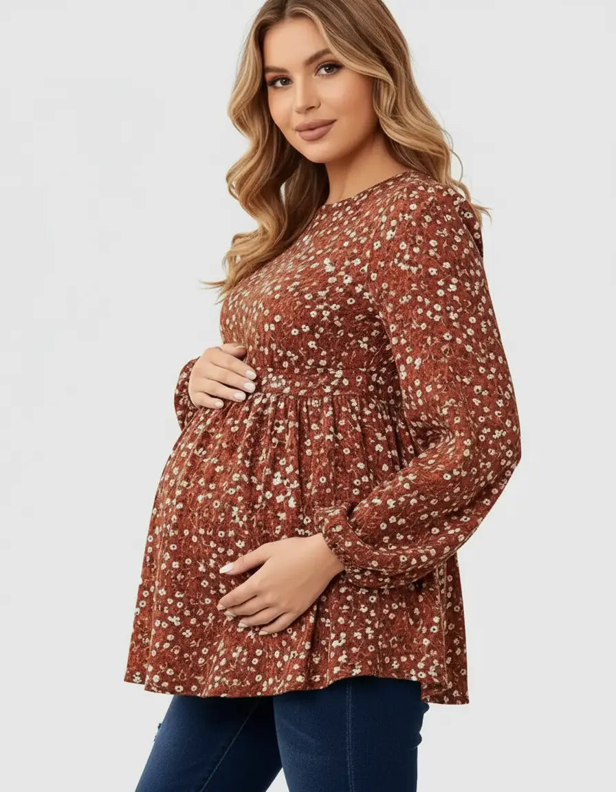 Maternity top: pregnant woman in a brown floral print, long-sleeve, tie-waist top.