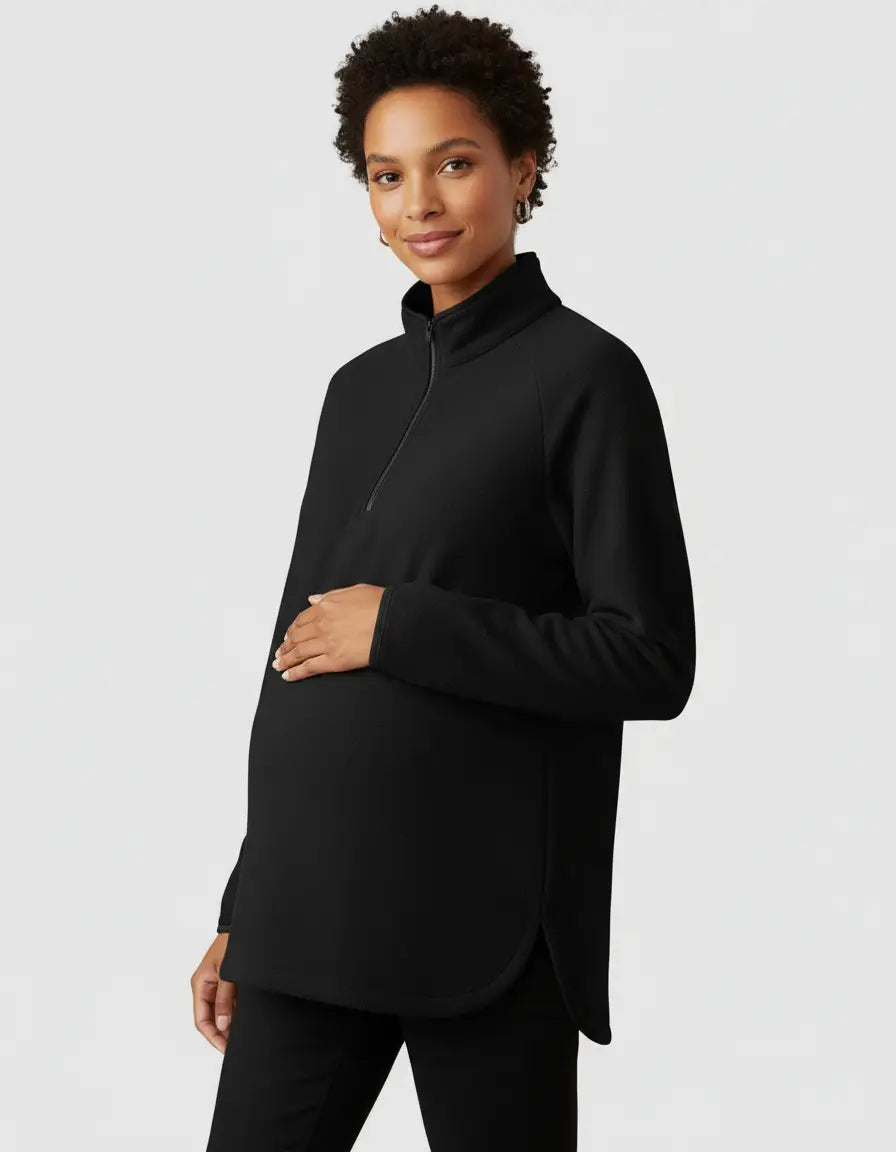 Black half-zip long sleeve maternity top with a stand collar, relaxed fit, and side slits.