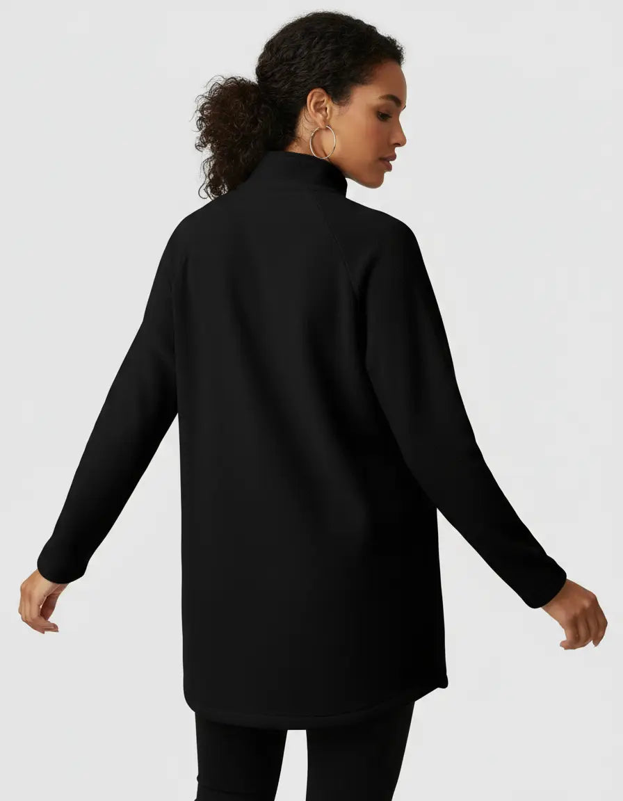 Woman in a black long-sleeve maternity half-zip top with a stand collar and relaxed fit.