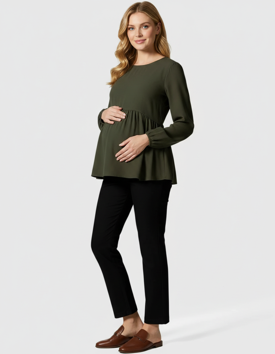 Pregnant woman in a dark olive green peplum maternity top and black high-waist kick flare maternity pants.