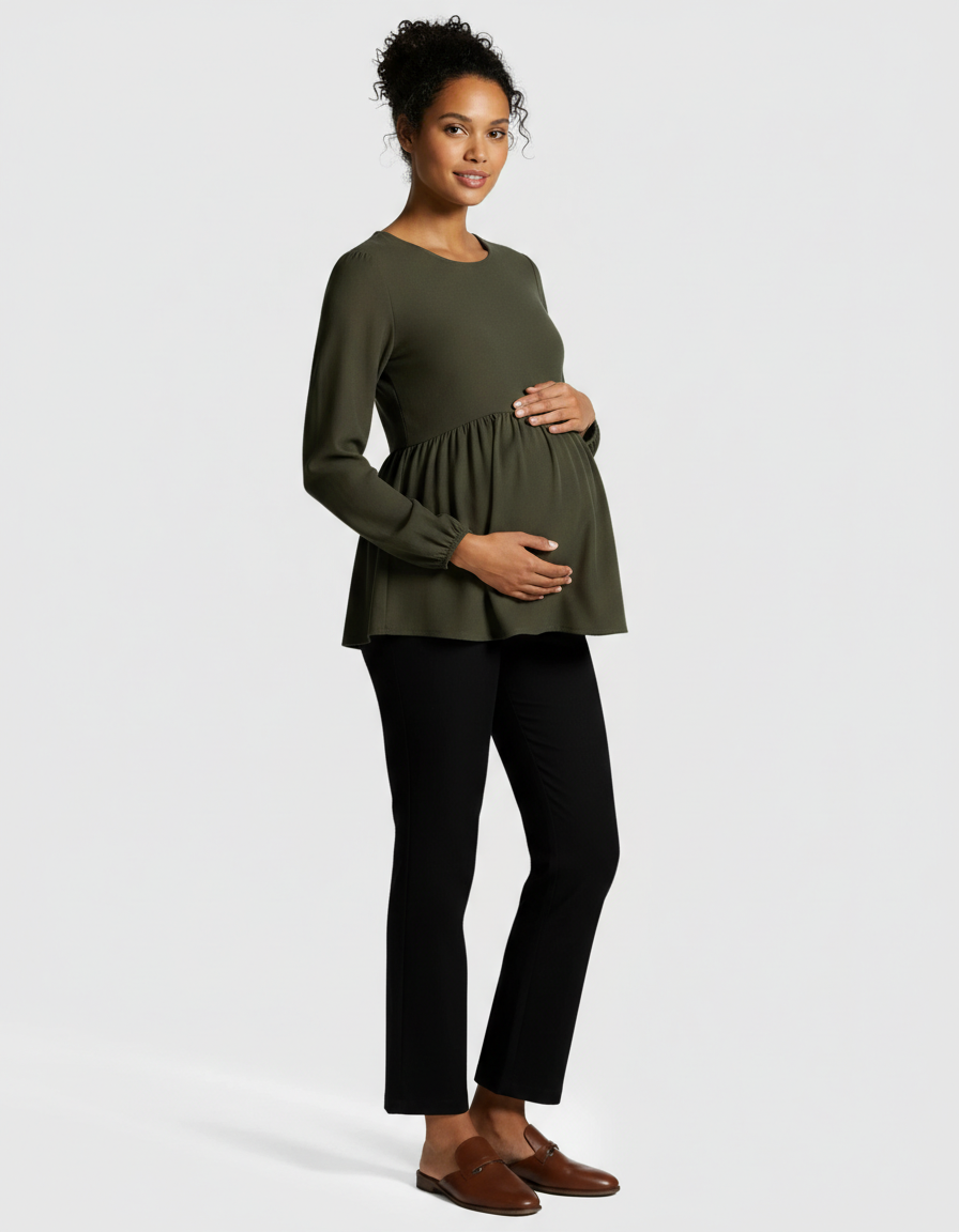 Pregnant woman in olive green peplum maternity top and black high-waist kick flare pants.