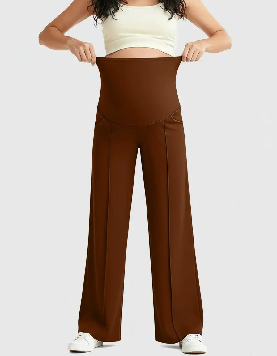 Woman wearing brown high-waist maternity pants with a relaxed fit and a supportive belly panel.
