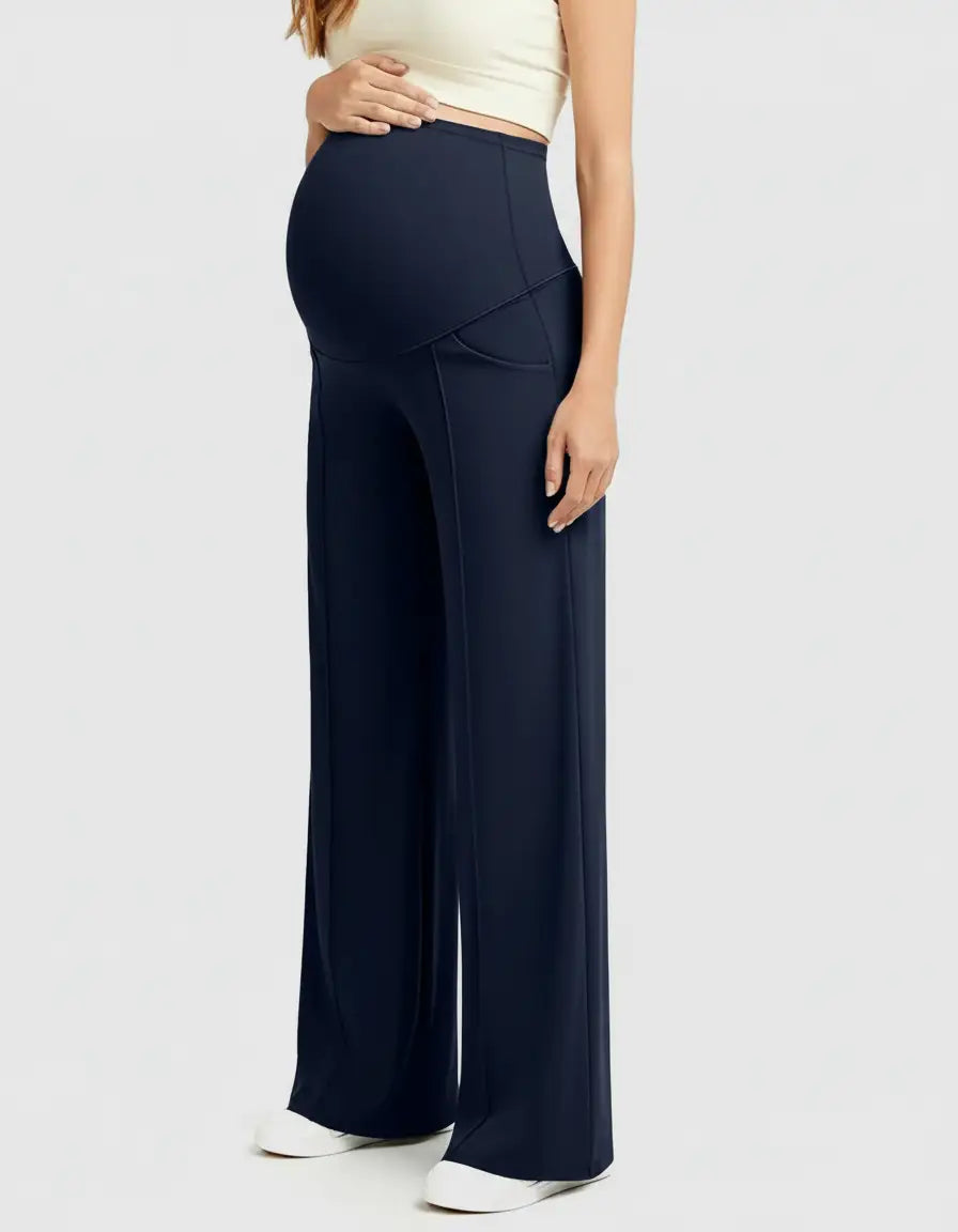 Pregnant woman wearing navy high-waist, relaxed-fit maternity pants with a wide leg and belly support.
