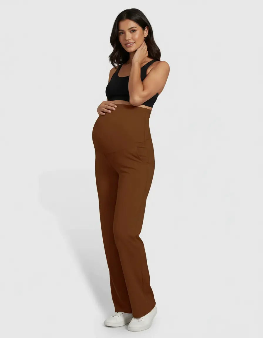 Pregnant woman modeling high-waist, straight-leg maternity pants in a warm brown color.