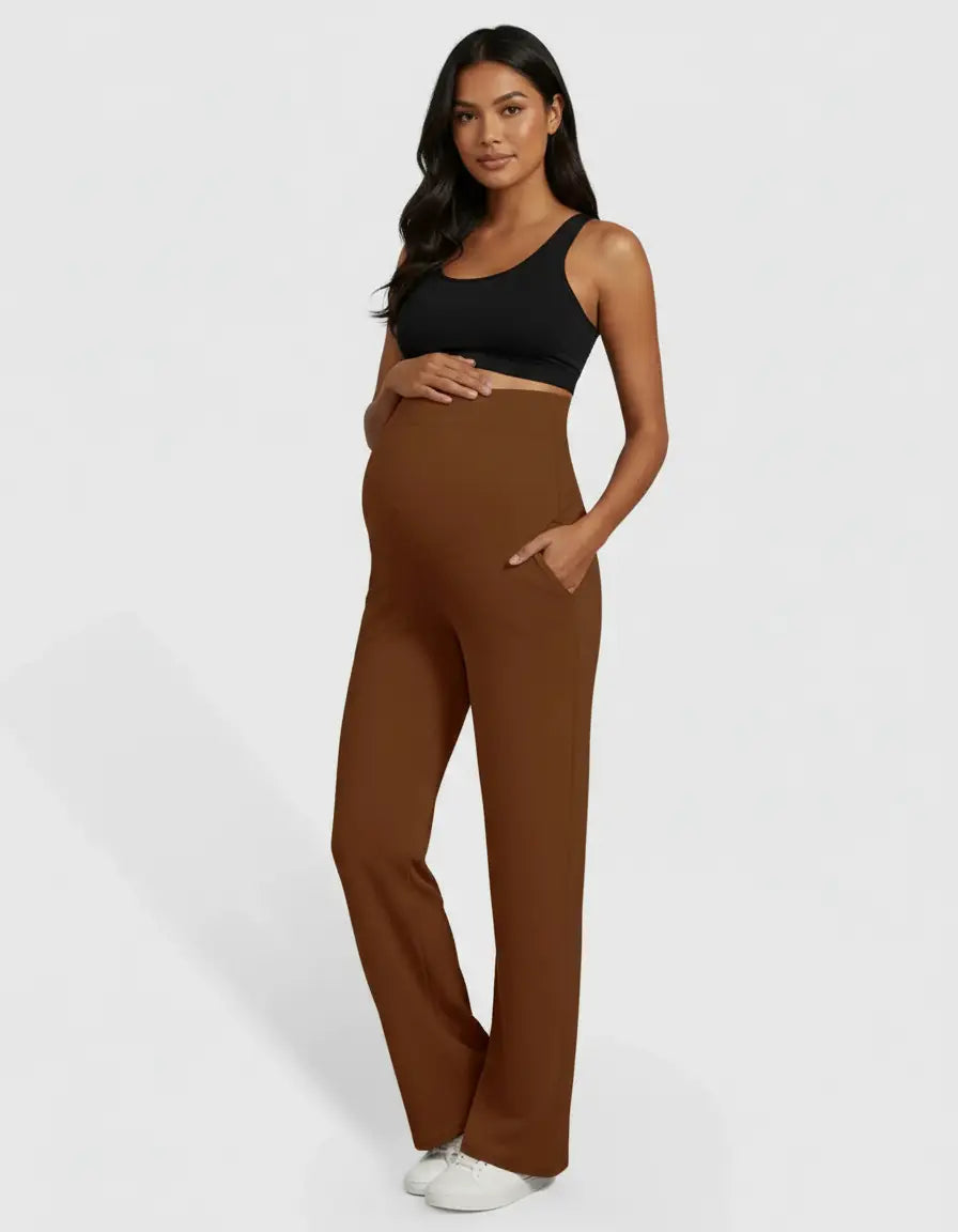 Pregnant woman in brown high-waist straight-leg maternity pants with pockets and a black top.