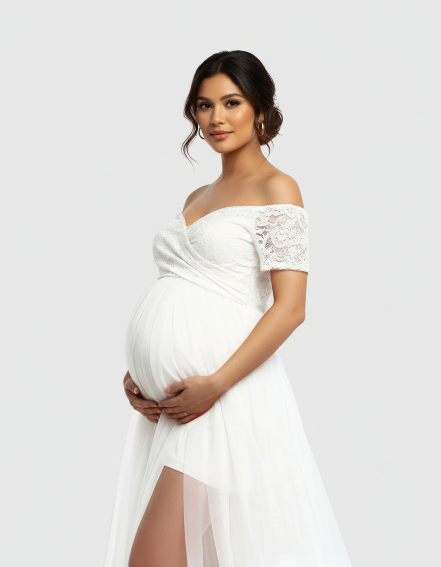 Pregnant woman in white lace & mesh off-shoulder maternity gown with high slit.