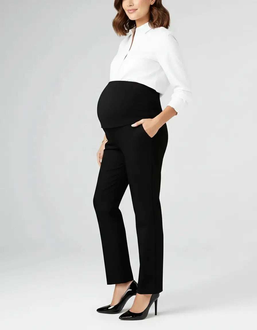 Pregnant woman in black mid-waist straight-leg maternity work pants with an over-the-bump panel.