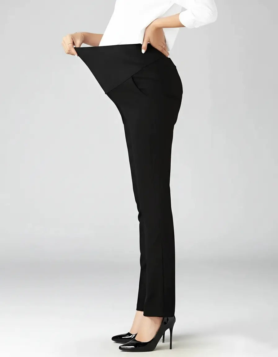 Black mid-waist straight-leg maternity work pants with a supportive belly panel, worn by a pregnant woman.