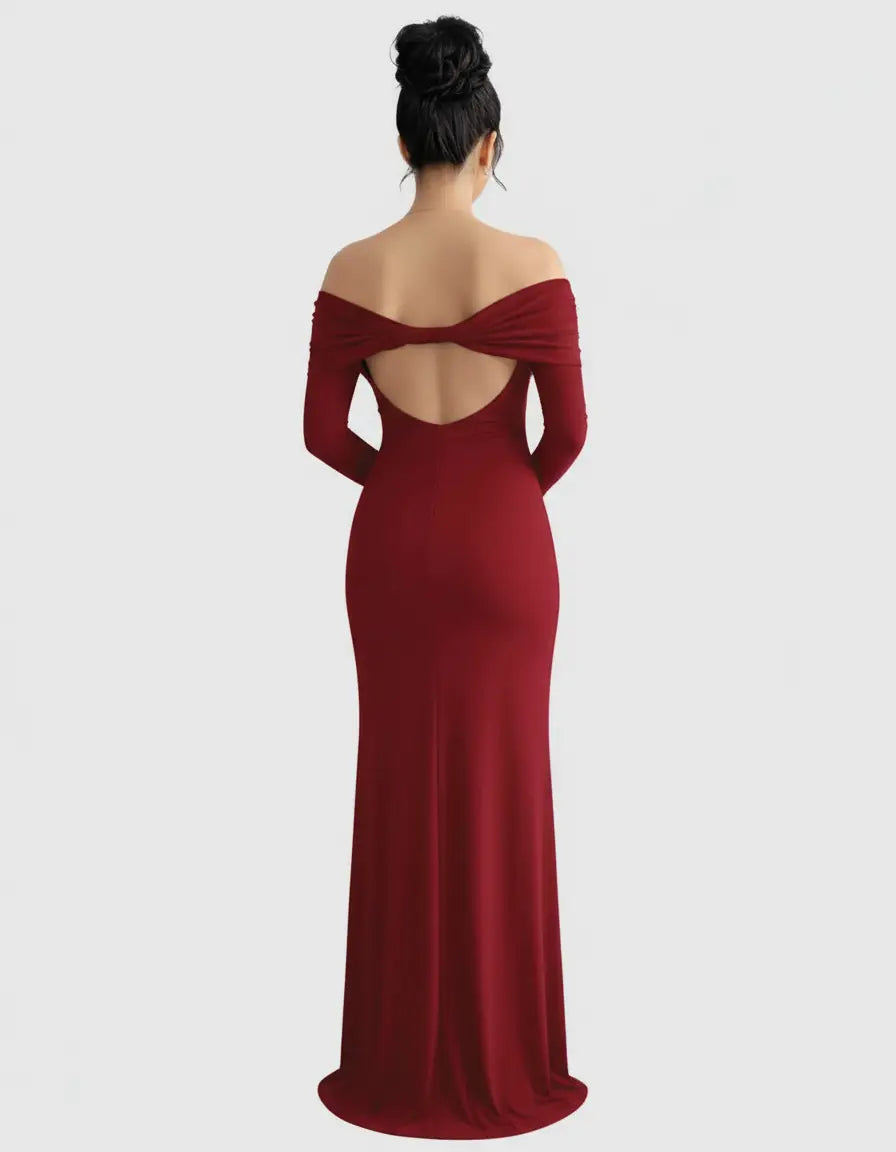 Red off-shoulder cross-back maternity gown with long sleeves, shown from the back.