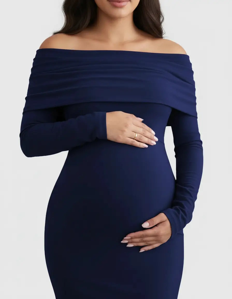 Navy off-shoulder cross-back maternity gown with long sleeves, worn by a pregnant woman.
