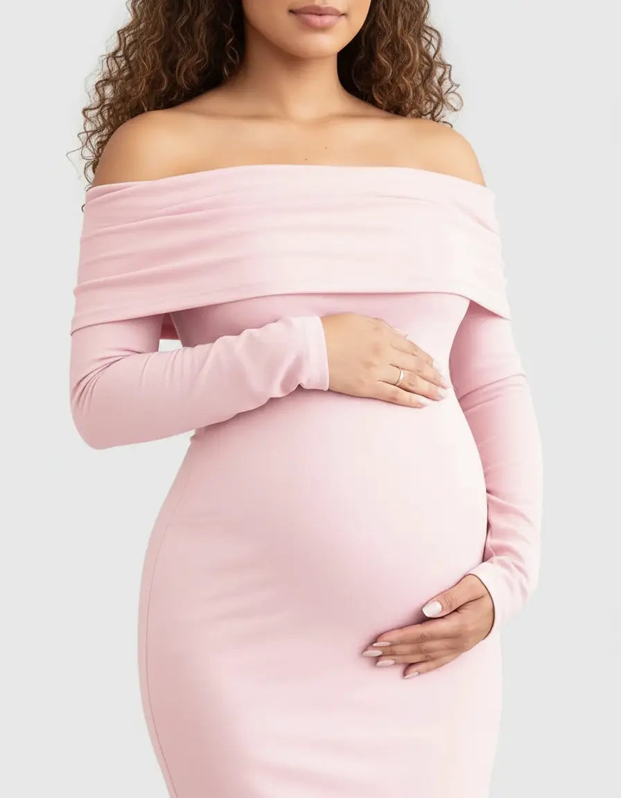 Pregnant woman in a pink off-shoulder, long-sleeve maternity gown, gently cradling her bump.
