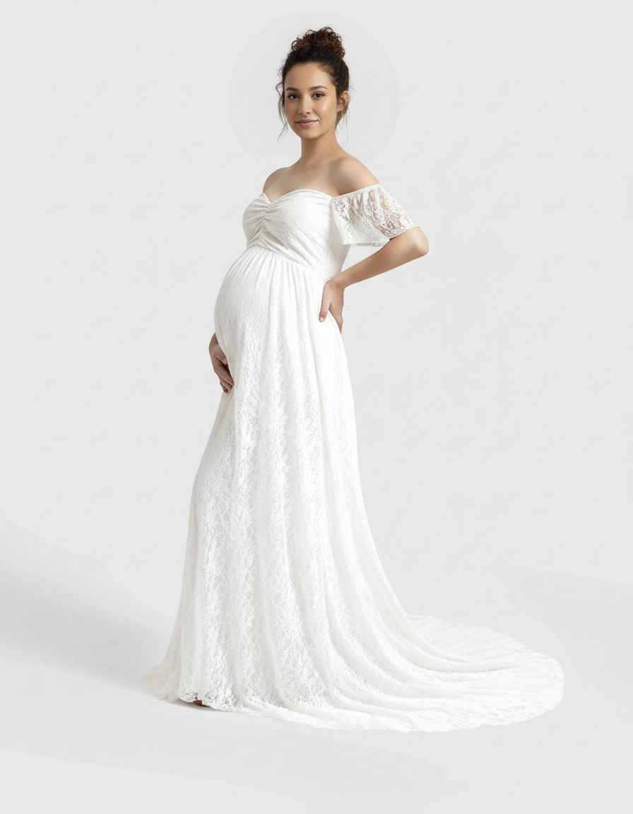 Pregnant woman in a white off-shoulder flowing lace maternity maxi dress with a long train.