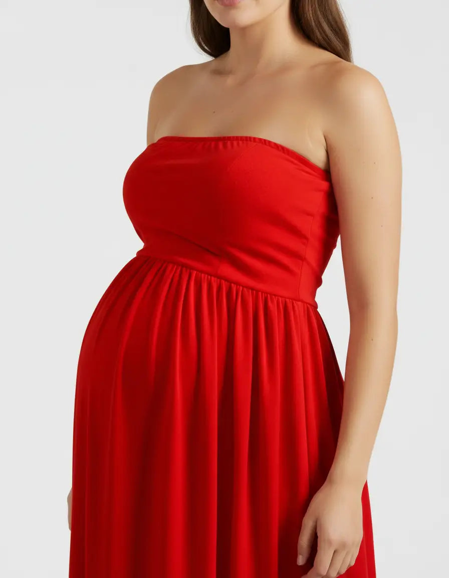 Red strapless flowing maternity photoshoot gown with a gathered empire waist.