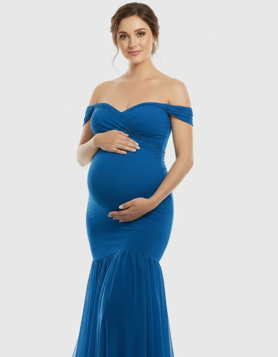 Pregnant woman in a blue off-shoulder flowy maternity gown with a sweetheart neckline and mermaid hem.