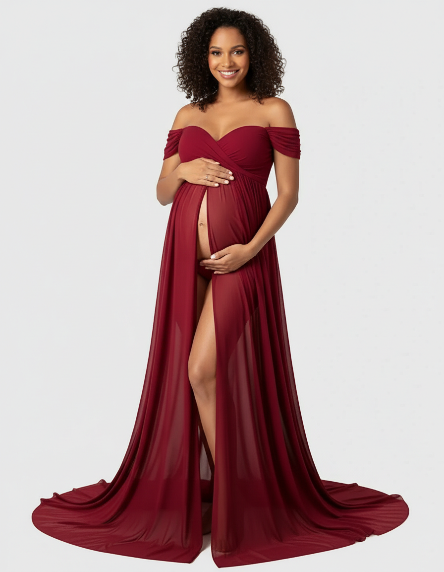 Smiling pregnant woman in a flowing, off-shoulder burgundy chiffon maternity maxi dress with a high slit.