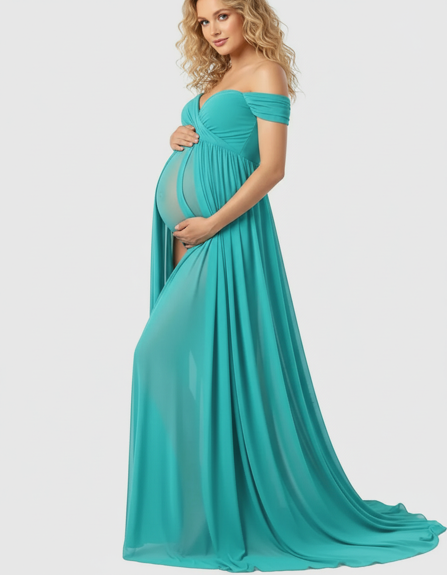 Maternity maxi dress in teal with off-shoulder sleeves, a flowing skirt, and a sheer belly panel.