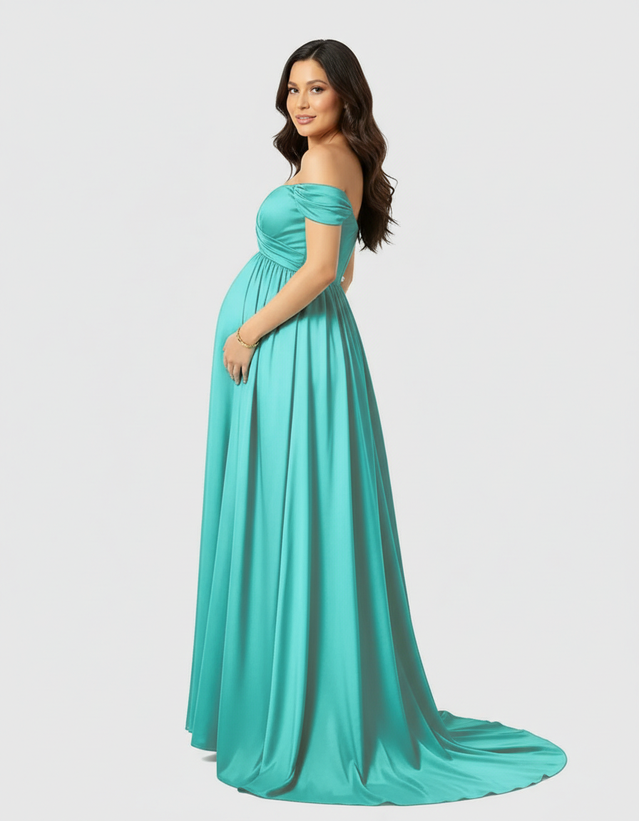 Pregnant woman in a flowing, off-shoulder teal maternity maxi dress with a long train.