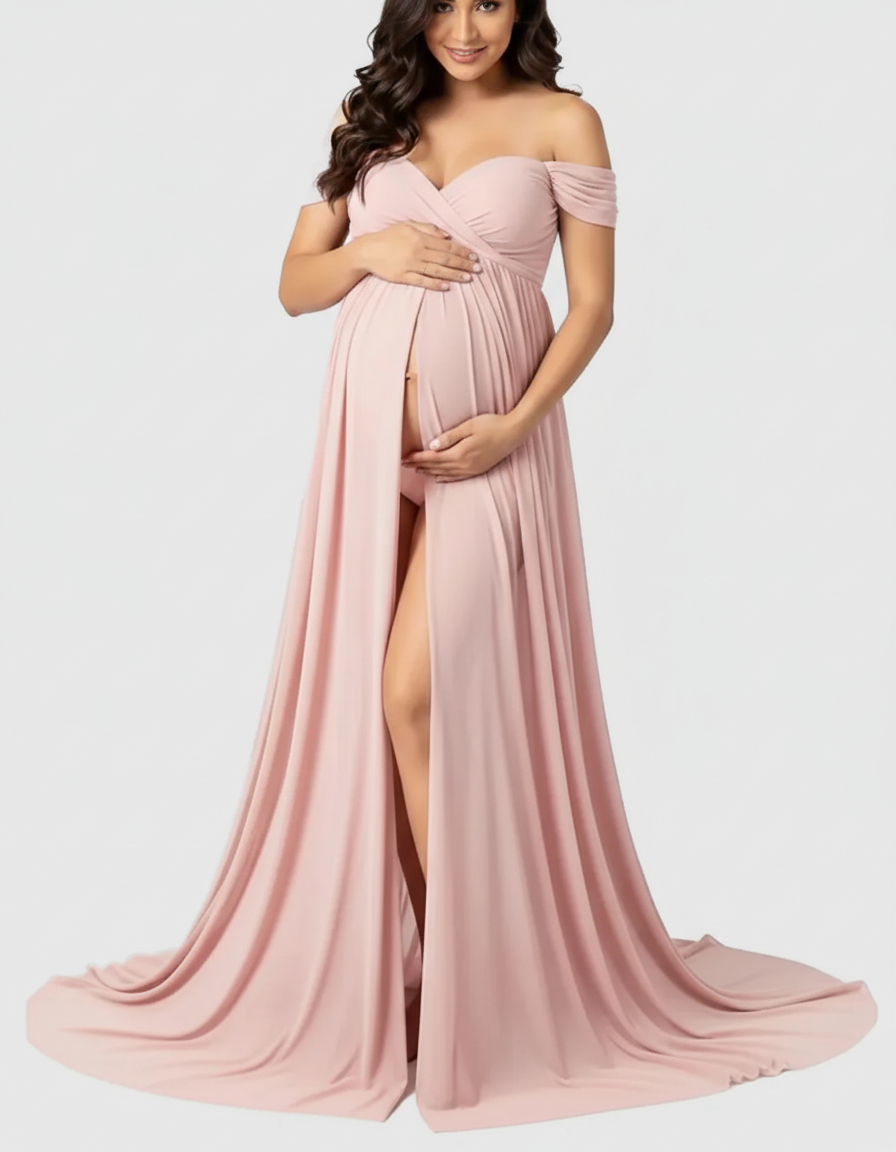 Maternity maxi dress in soft pink, off-shoulder, with a flowing skirt and front slit.