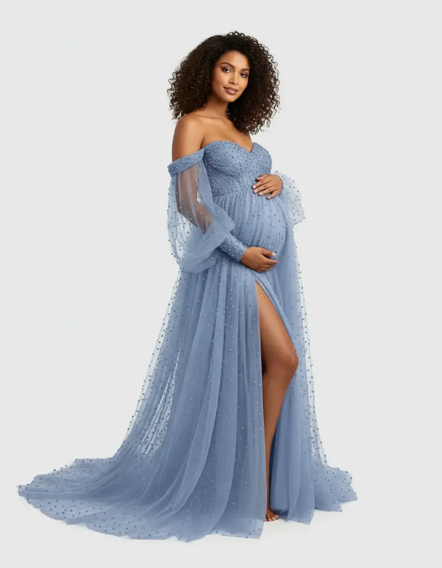 Maternity gown: off-shoulder, blue tulle with train, beaded, long sheer sleeves, and high slit.