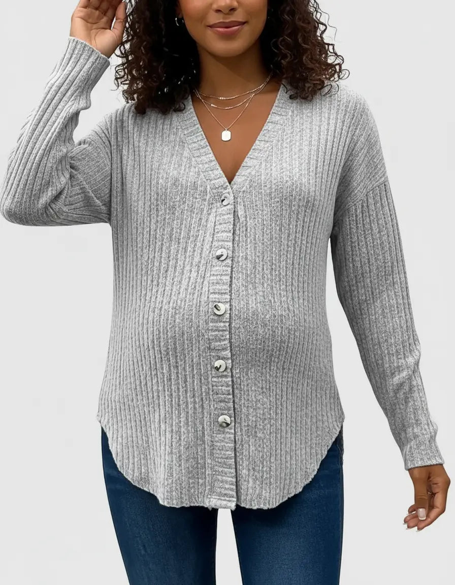 Maternity top: light gray ribbed knit, button-front, V-neck, drop shoulder, worn by a pregnant woman.