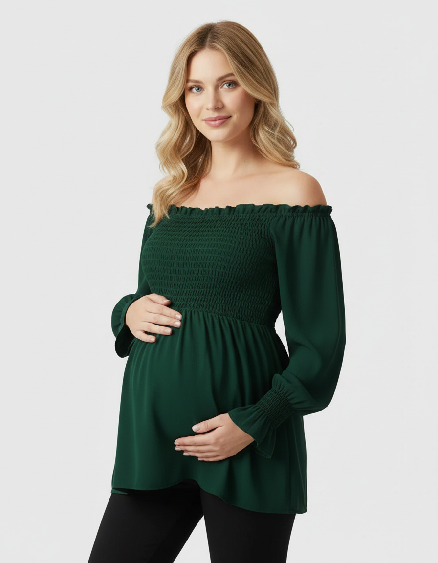 Pregnant woman in a dark green ruched off-shoulder maternity top with long sleeves.
