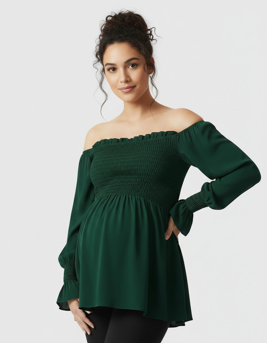 Pregnant model in a dark green ruched off-shoulder maternity top with long sleeves.
