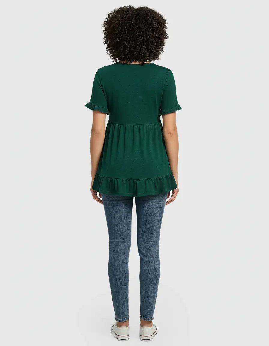 Back view of a woman wearing a green ruffled-sleeve, flowy-fit maternity top and blue jeans.