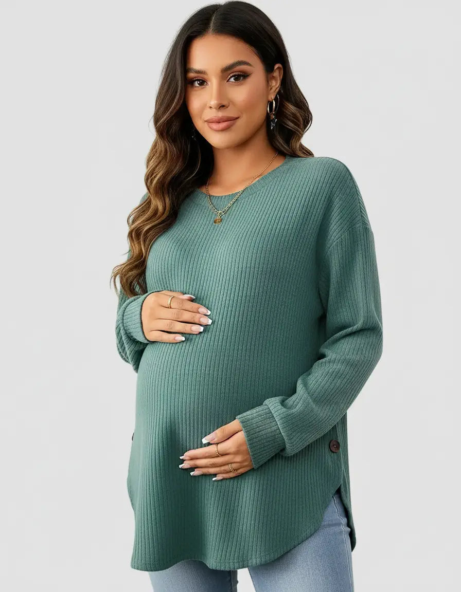 Pregnant woman wearing a soft-knit, relaxed-fit teal maternity sweatshirt with side buttons.