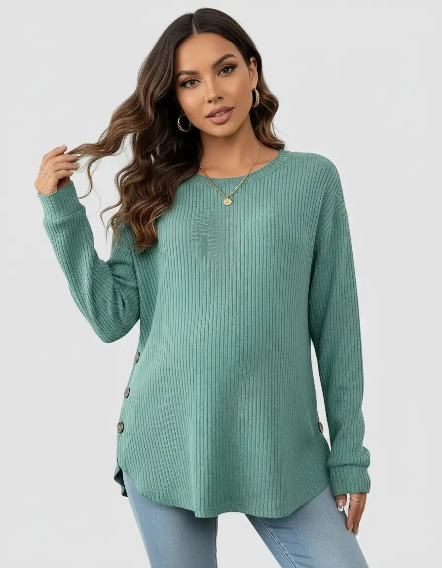 Woman wearing a soft-knit, relaxed-fit maternity sweatshirt in teal with side buttons.