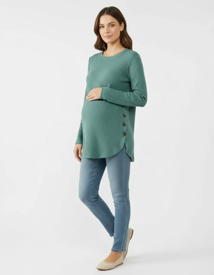 Pregnant woman in a soft-knit, relaxed-fit teal maternity sweatshirt with side buttons and a curved hem.