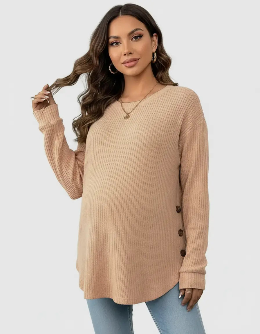 Maternity model in a peach soft-knit relaxed-fit sweatshirt with side buttons, long sleeves, and a round neck.
