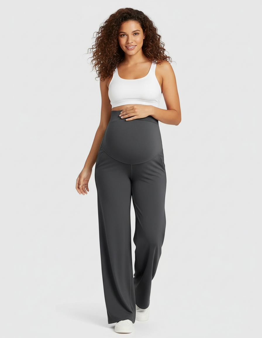 Woman in dark gray soft stretch high-rise wide-leg maternity pants with belly support panel.
