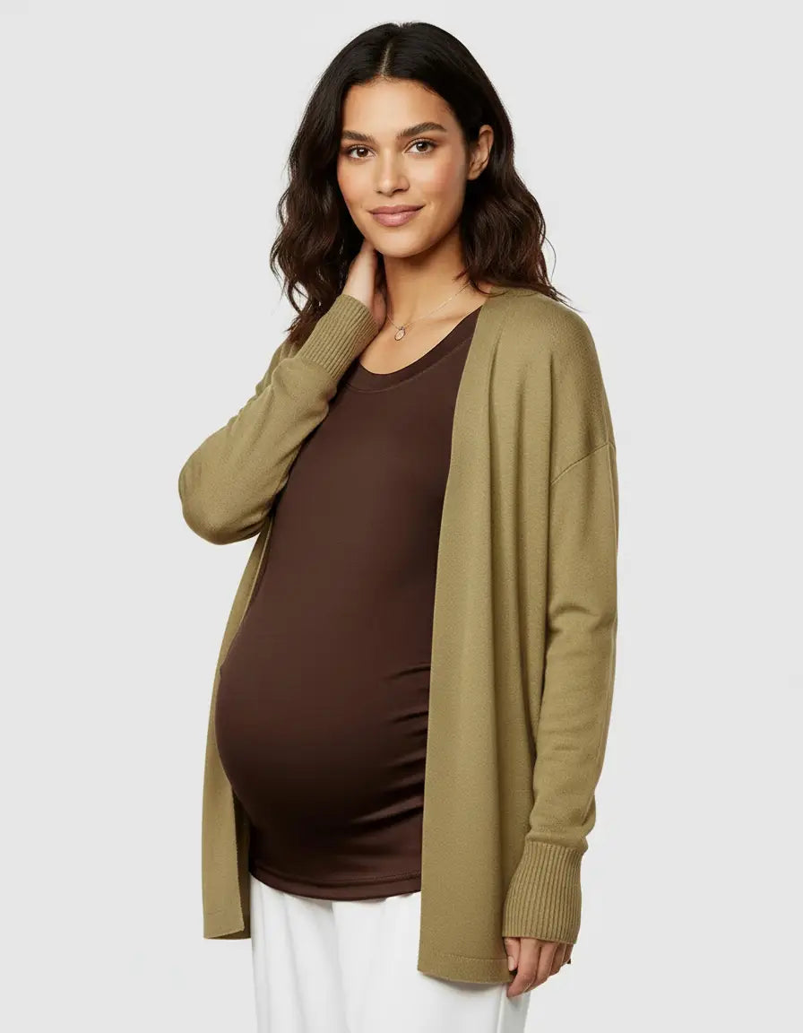 Pregnant woman in a brown thermal long sleeve maternity top and olive green cardigan.