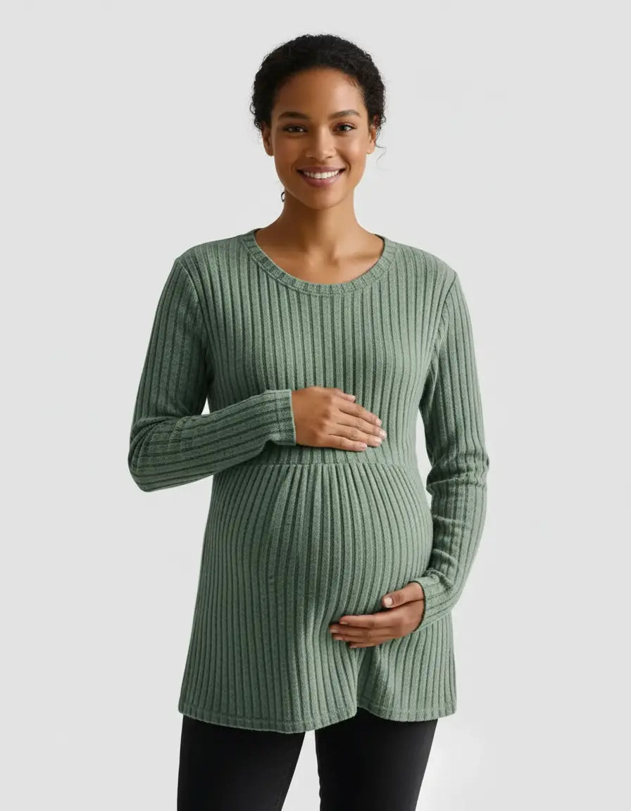 Smiling pregnant woman in a sage green stretch-ribbed casual-fit maternity top.