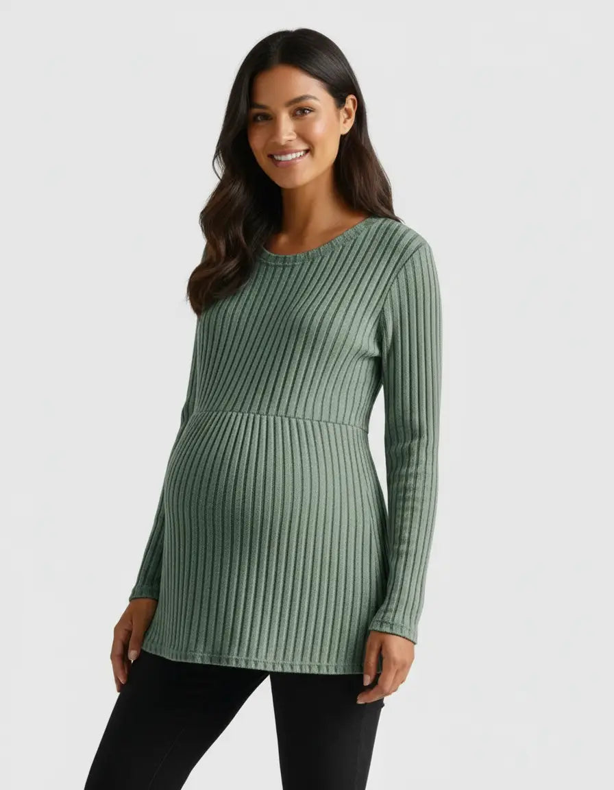 Smiling pregnant woman in a sage green stretch-ribbed long-sleeve maternity top.