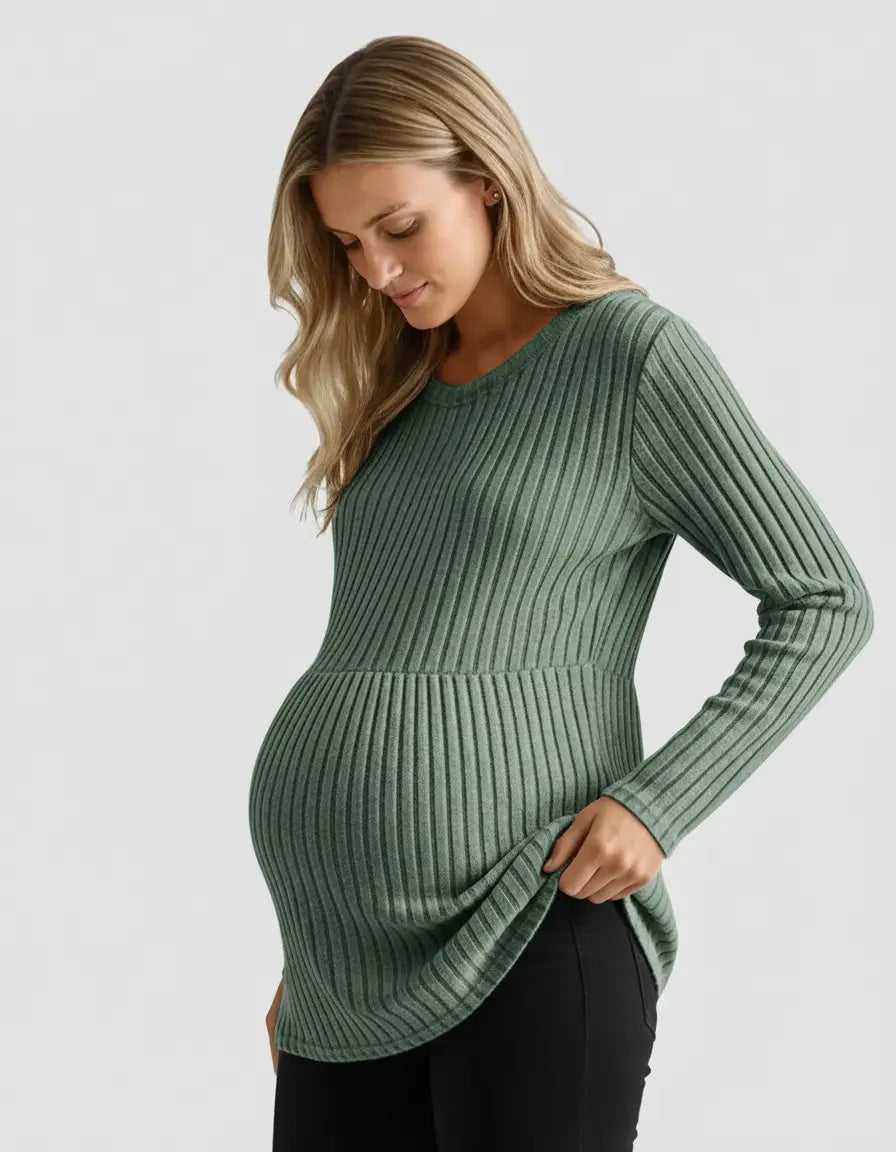 Pregnant woman in a sage green stretch-ribbed casual-fit maternity top, designed for comfort.