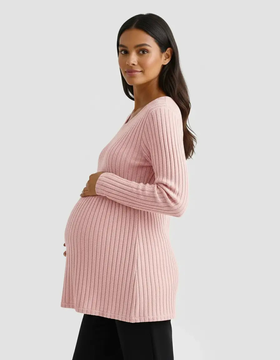 Pregnant woman in a pink stretch-ribbed casual-fit maternity top, holding her belly.