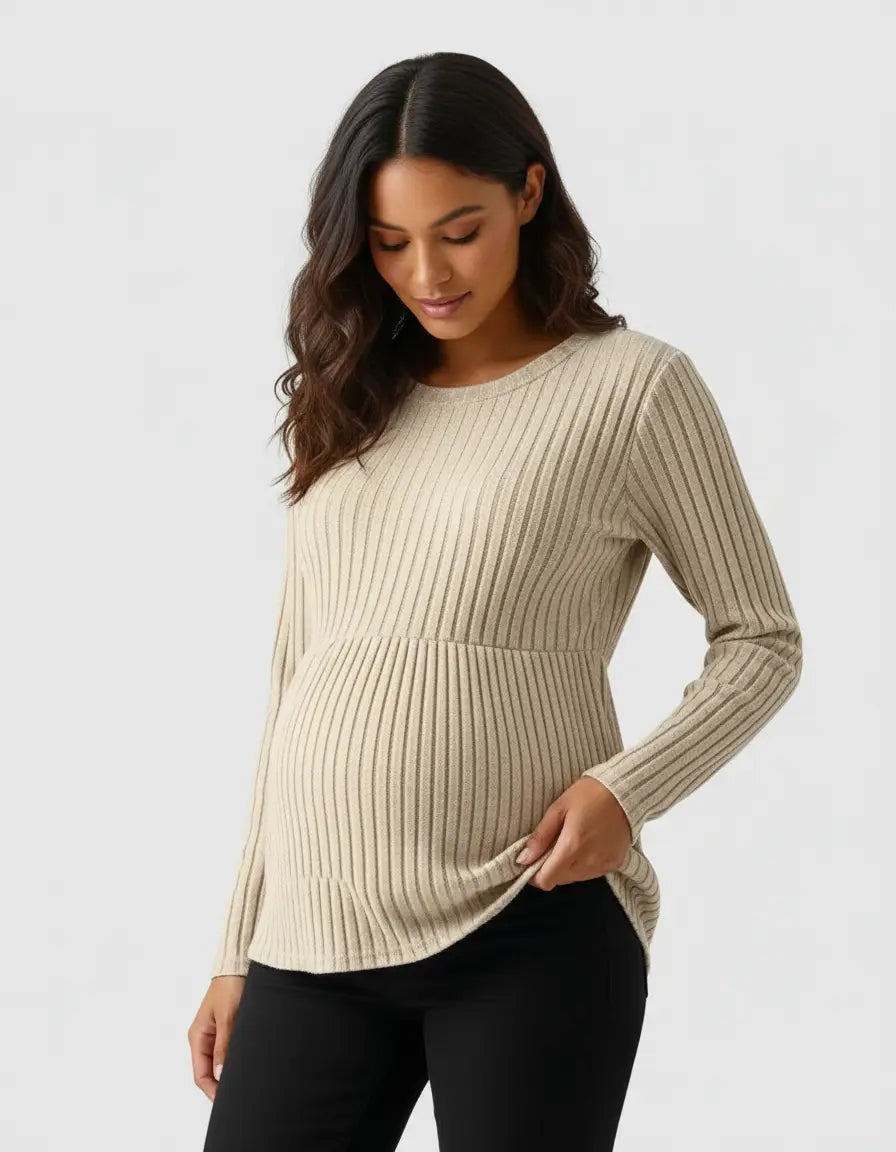 Pregnant woman wearing a beige stretch-ribbed casual-fit maternity top with long sleeves.