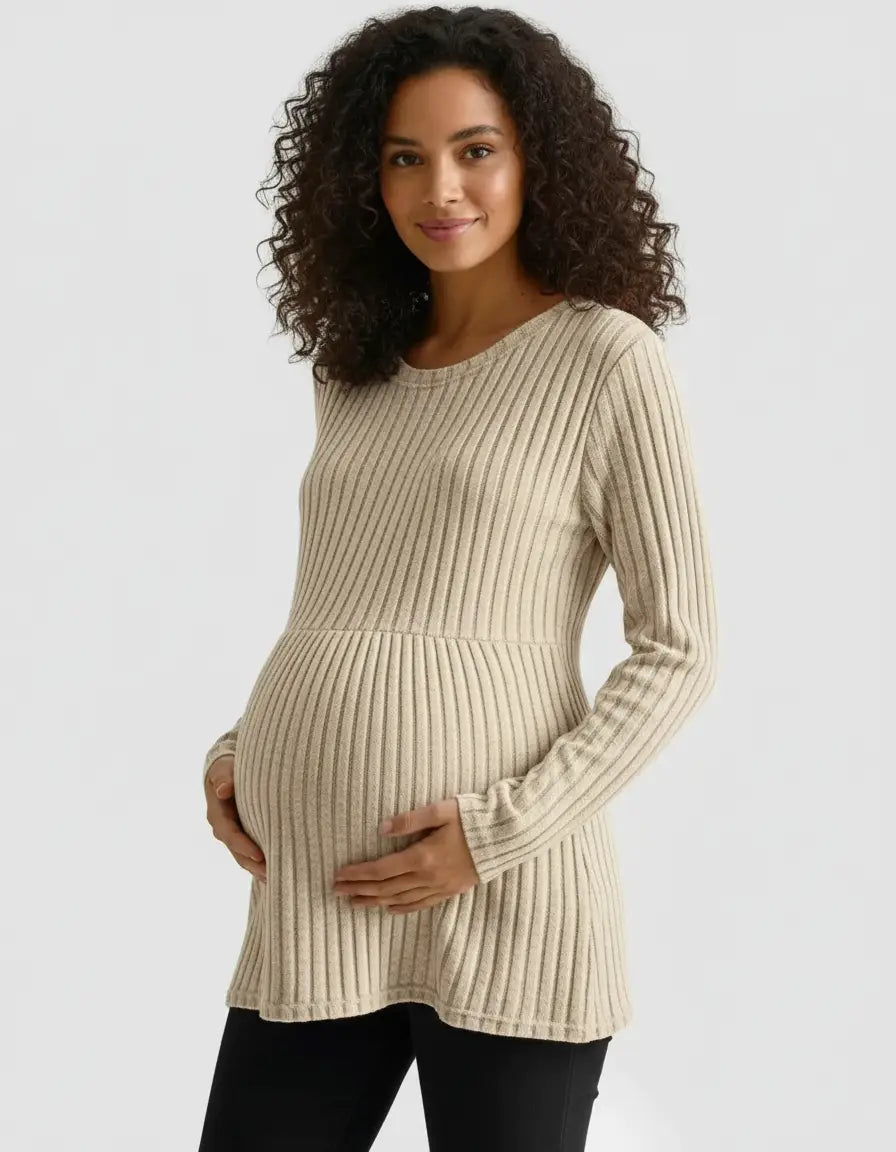 Pregnant woman in a beige stretch-ribbed casual-fit maternity top with long sleeves.