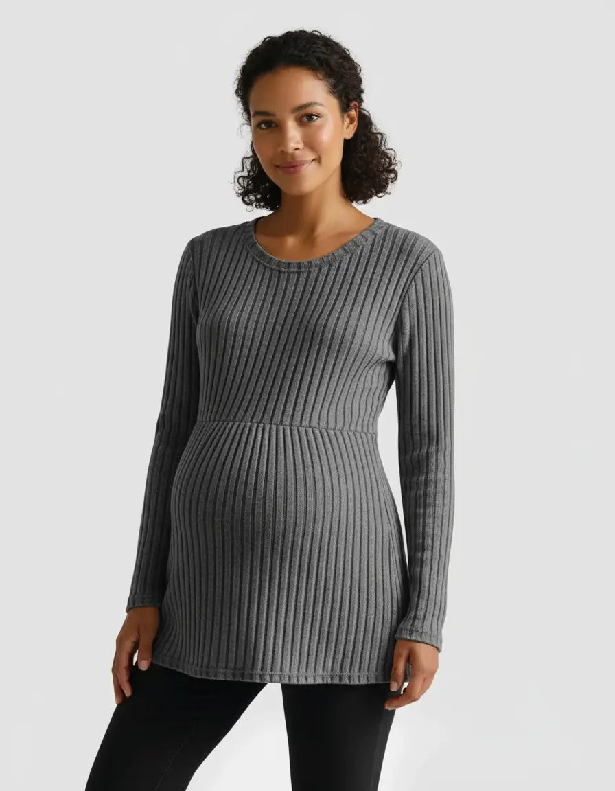 Smiling pregnant woman wearing a gray stretch-ribbed long-sleeve maternity top.