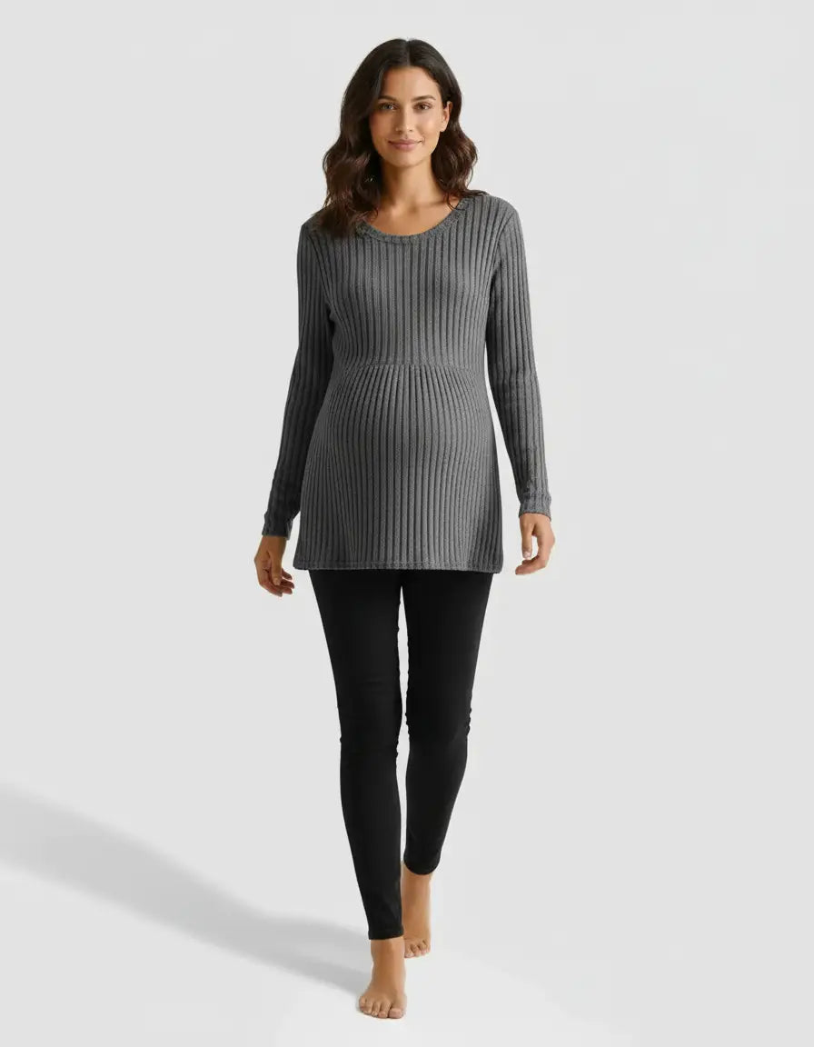 Smiling pregnant woman in a gray stretch-ribbed long-sleeve maternity top and black leggings.