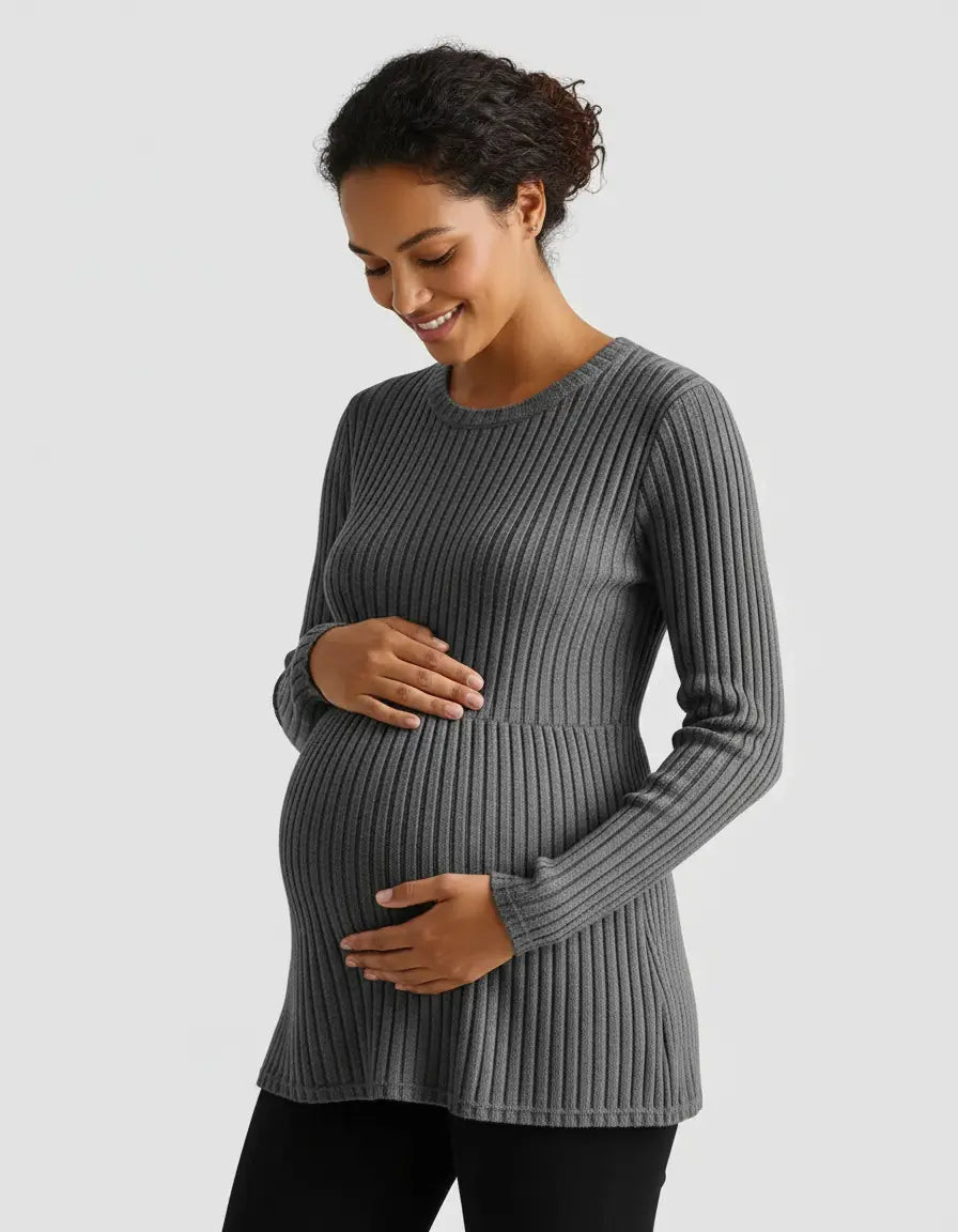 Smiling pregnant woman in a gray stretch-ribbed casual-fit maternity top with long sleeves.