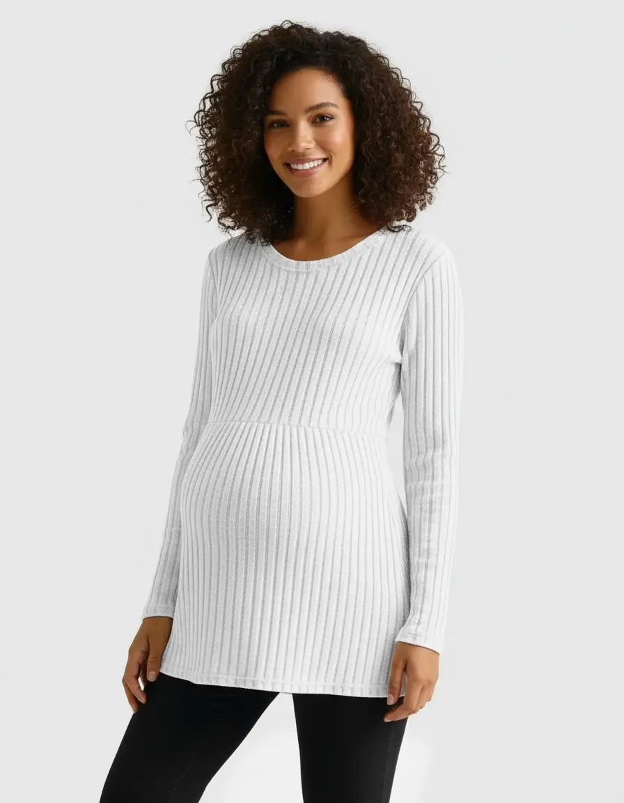 Smiling pregnant woman in a white stretch-ribbed long-sleeve maternity top.